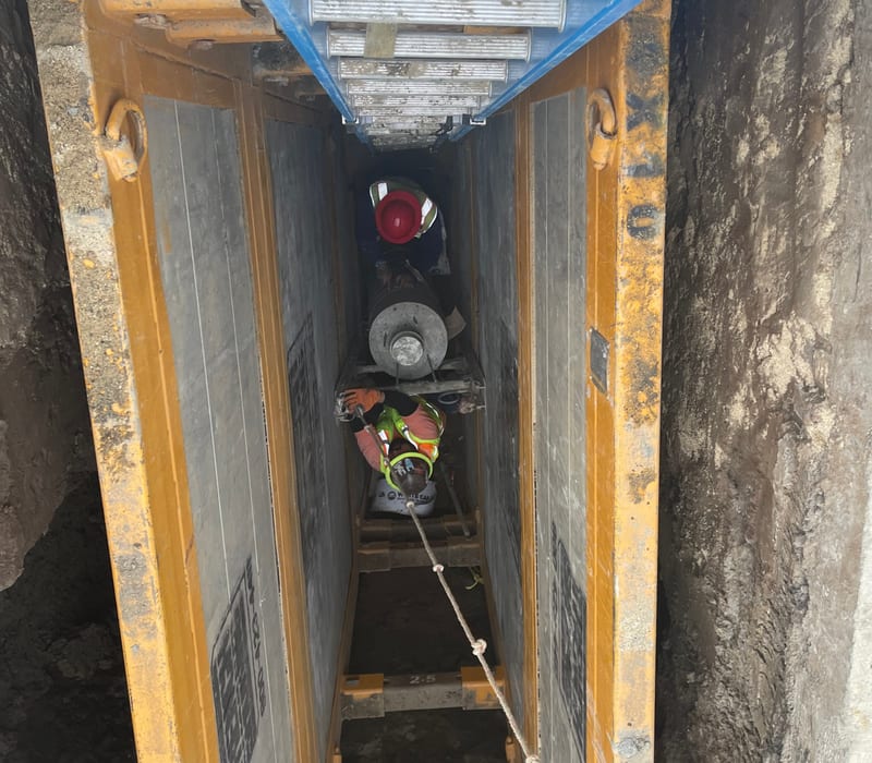 Excavator doing underground utility work